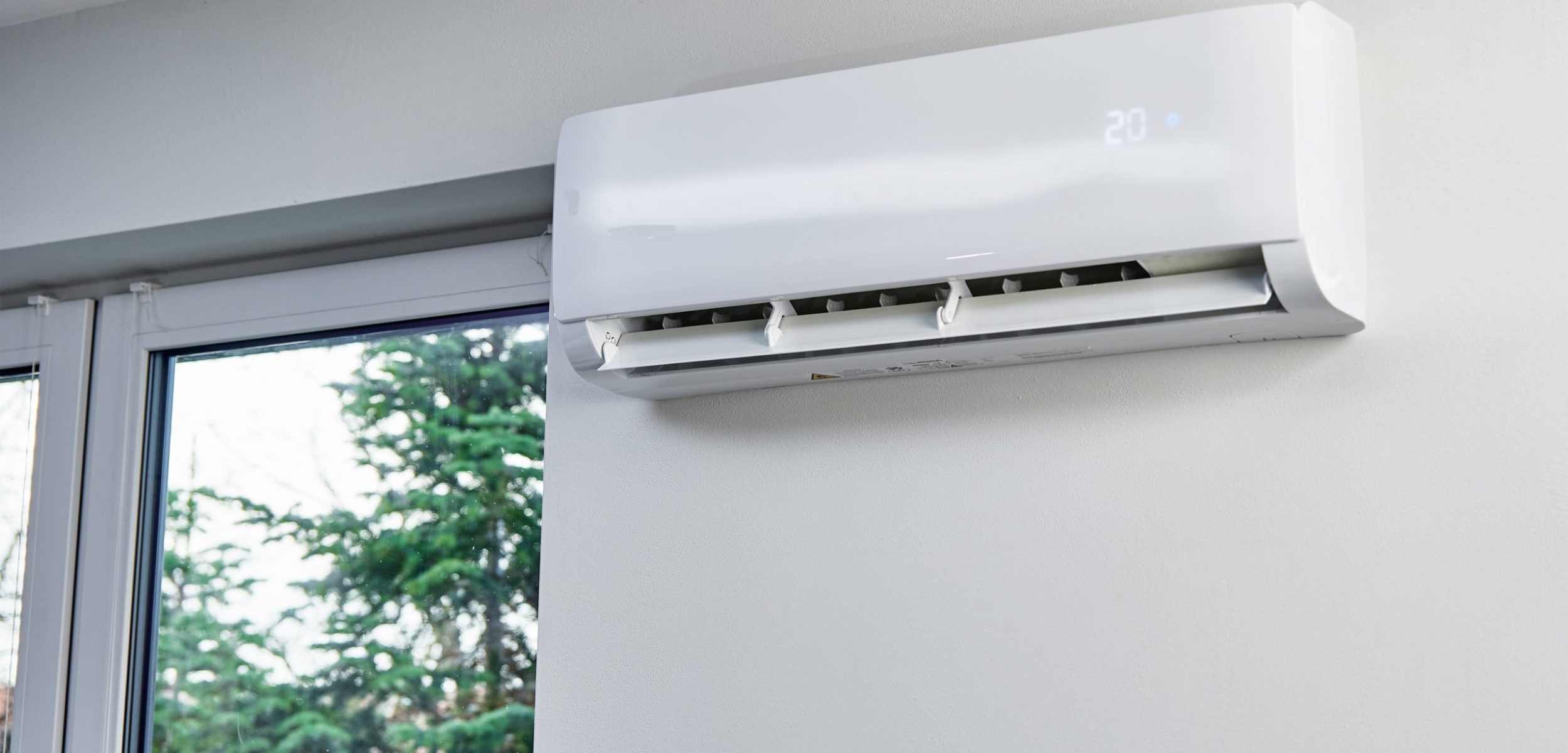 Adjusting temperature on air conditioner, Working air conditioner for comfort temperature in home at hot summer, cooling air in the room